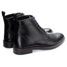 Aviemore Brogue Boot in Black, the pair shown from behind at three-quarter angle
